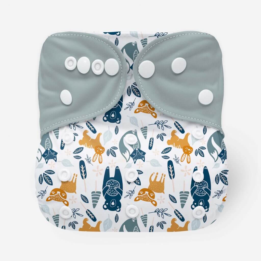 Cloth diaper with grey wings and woodland creatues in blue, grey and orange - on a white background