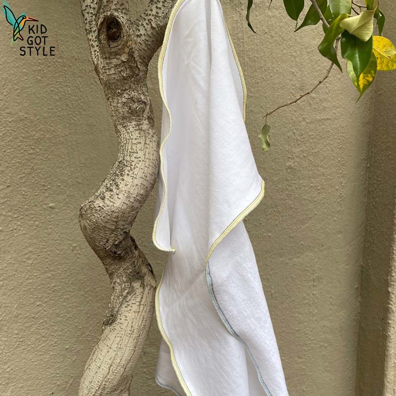 A flat style nappy hanging in a tree