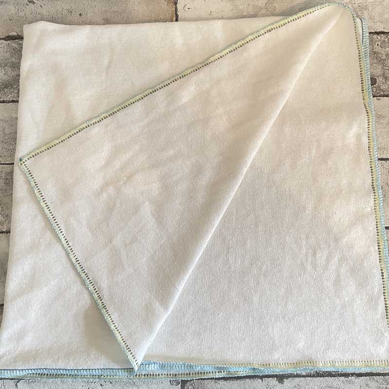 Cotton fleece nappy laid down with one corner flapped up