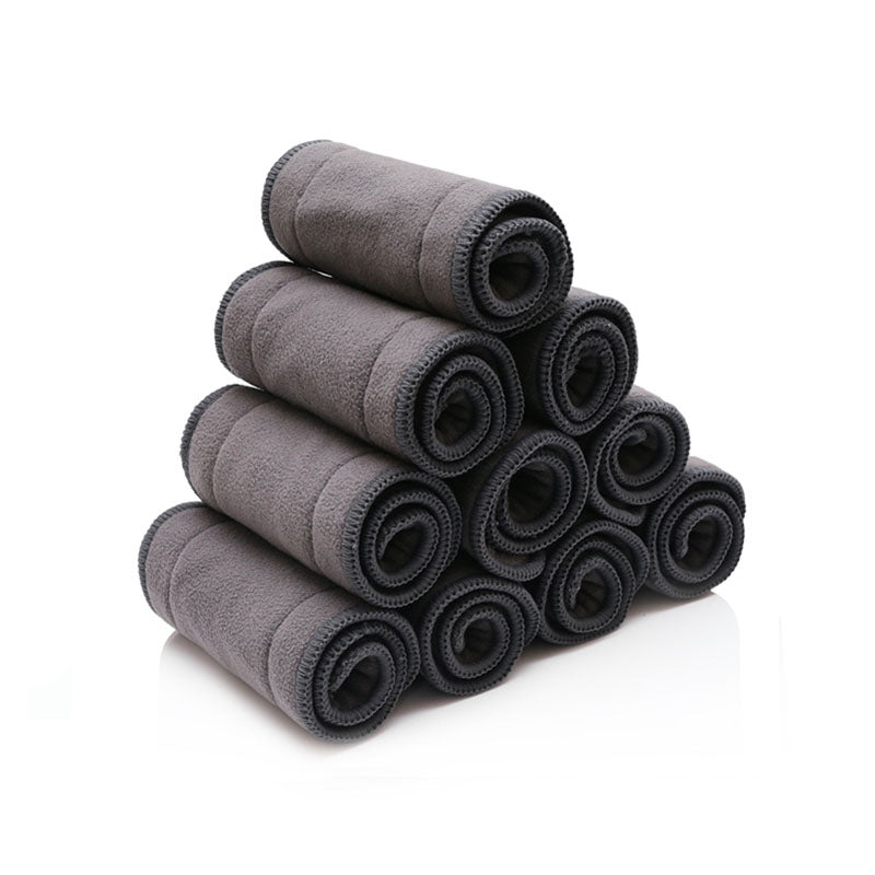 Rolled and stacked charcoal bamboo cloth diaper inserts