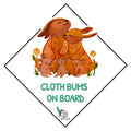 Cloth bum on board sticker with a family of rabbits
