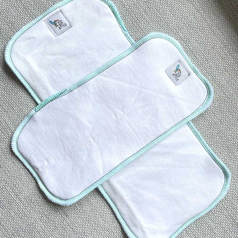 OSFM and newborn fat fleece cotton inserts crossed over each other