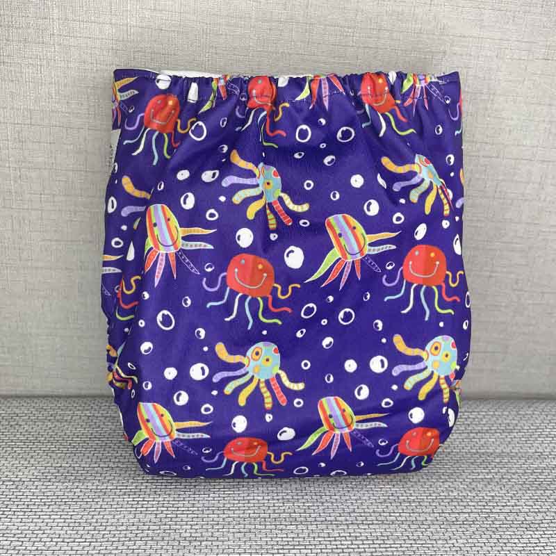 Back view of a blue reusable cloth nappy with smiling, happy octopuses and bubbles