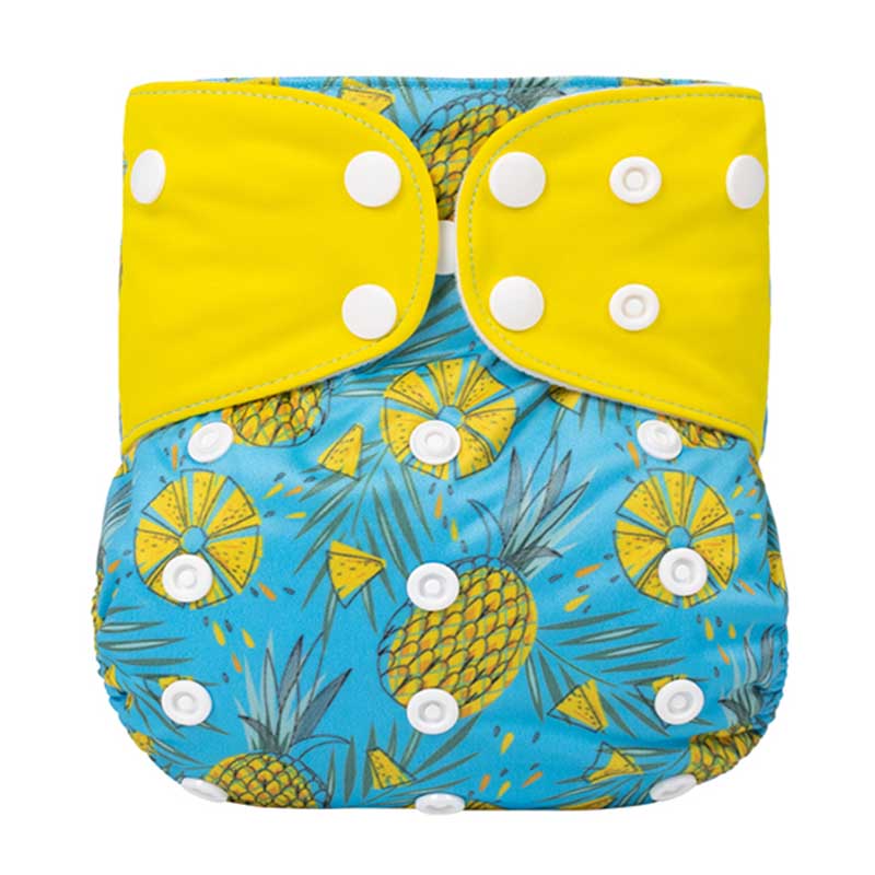 Bright cloth diaper with yellow wings, pineapples and a blue background